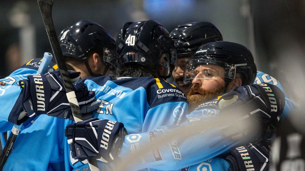 Blaze players celebrate a goal.