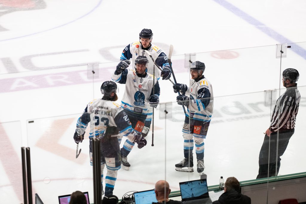Blaze players celebrate scoring.