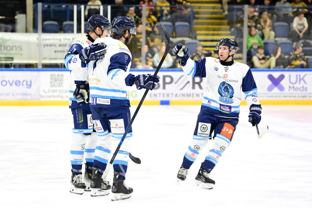 Connor Russell celebrates scoring with Blaze teammates.
