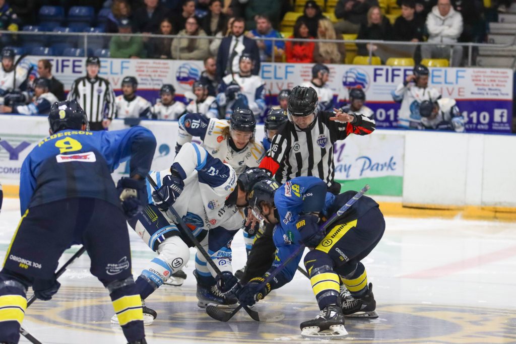 Blaze and Fife face-off at centre ice.