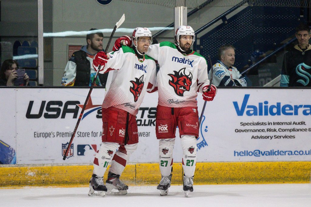 Brett Perlini celebrates scoring the opening goal. 