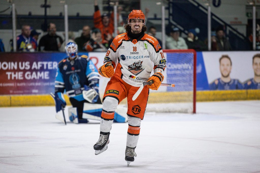 Tremblay celebrates scoring Steelers' fourth goal. 