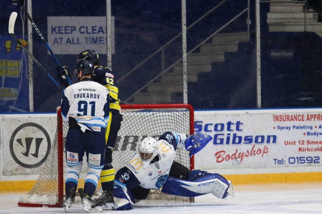 Stewart in action with a Fife player charging the net. 