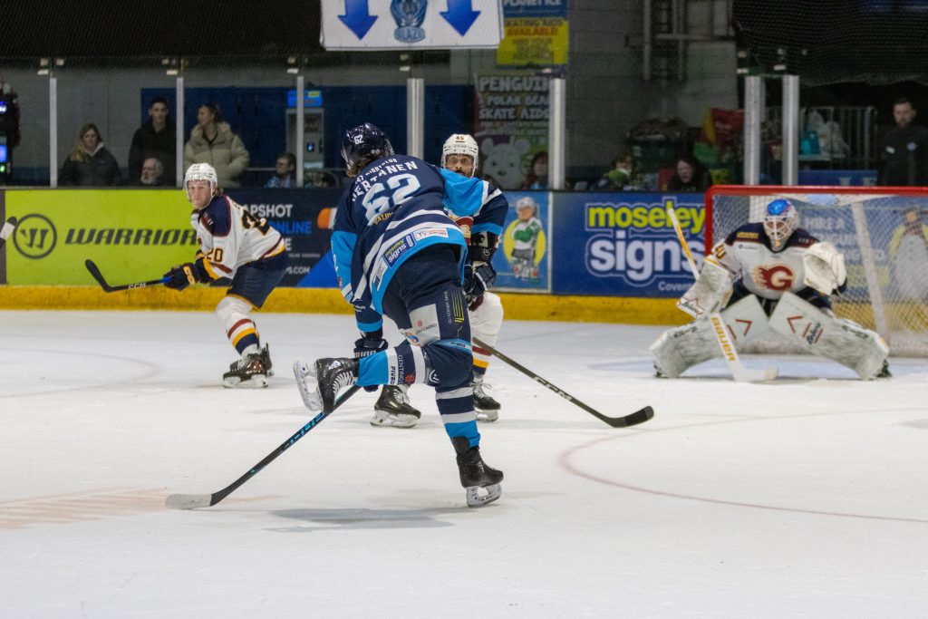 Vertanen shoots on the Flames net.