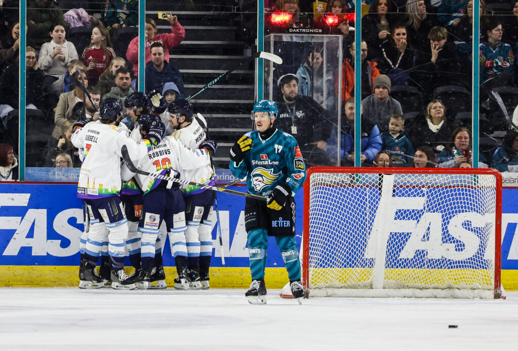 Blaze players celebrate scoring.