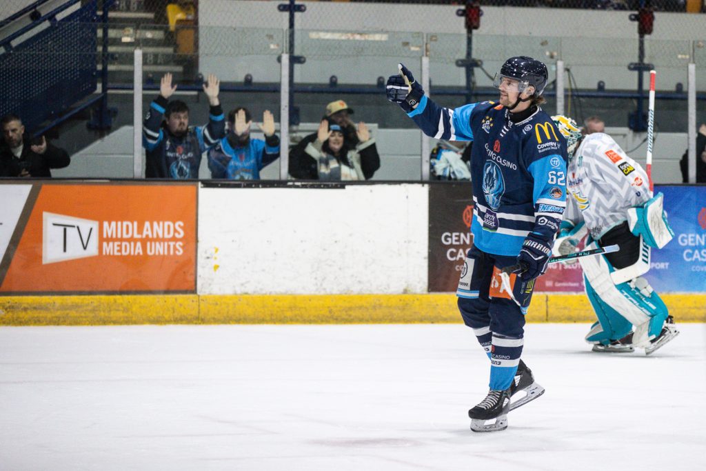 Jere Vertanen gives the crowd a thumbs up after scoring. 