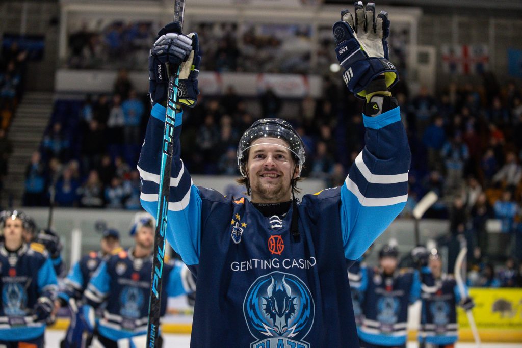 Vertanen celebrates with fans post-game.