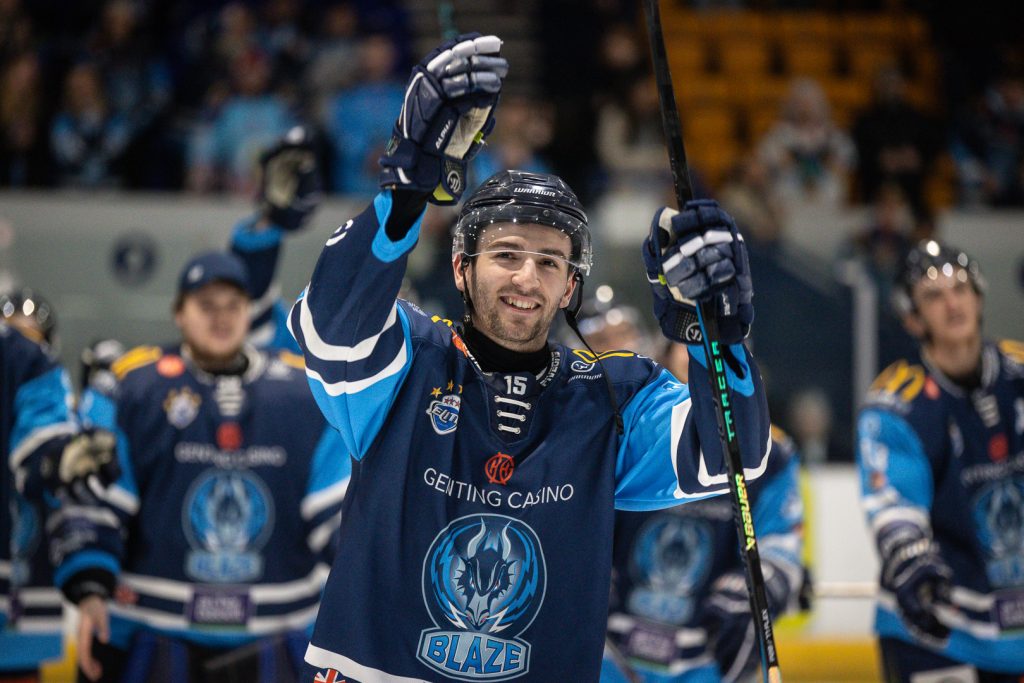 Hopkins celebrates with fans post-game.