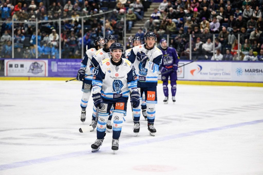 Luciani skates to the Blaze bench after scoring.