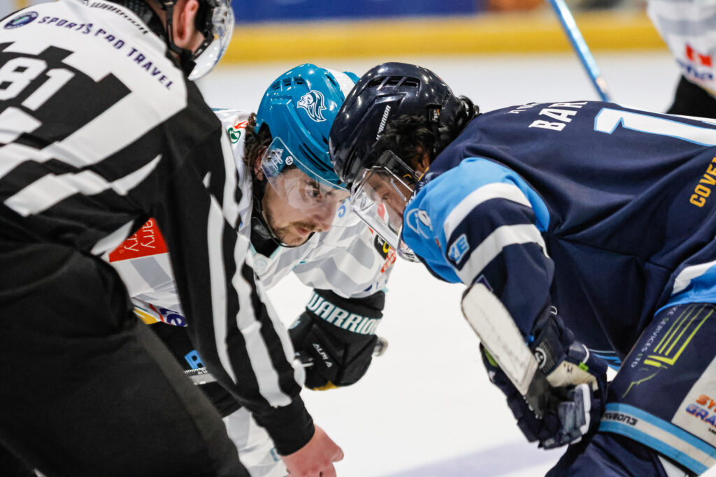Barriga lines up for a face-off with a Giants forward.