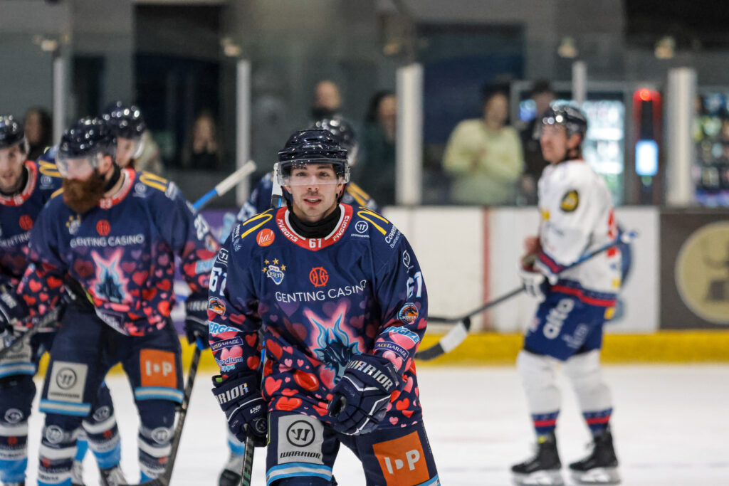 Luciani skates to the Blaze bench after scoring the first goal in his heart themed Valentine's jersey.