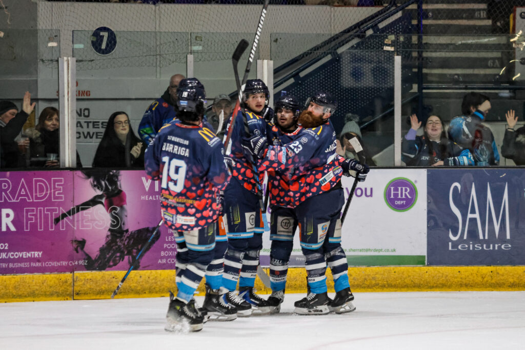 Blaze players celebrate scoring.