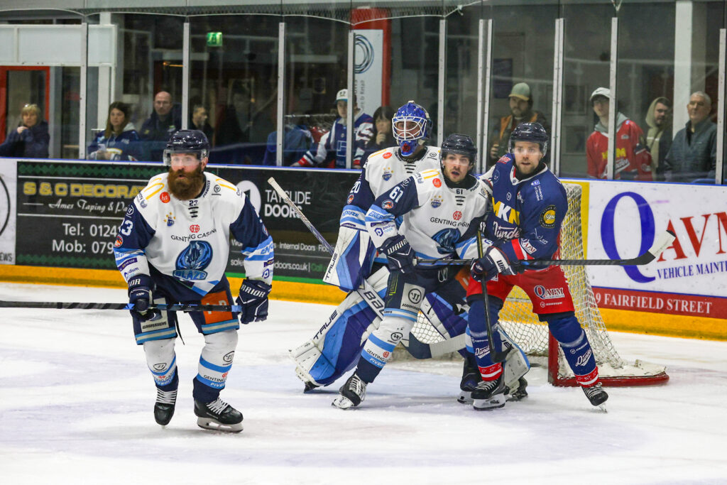 Alessio Luciani battles with a Stars forward with Mat Robson behind and Colton Saucerman jst in front.