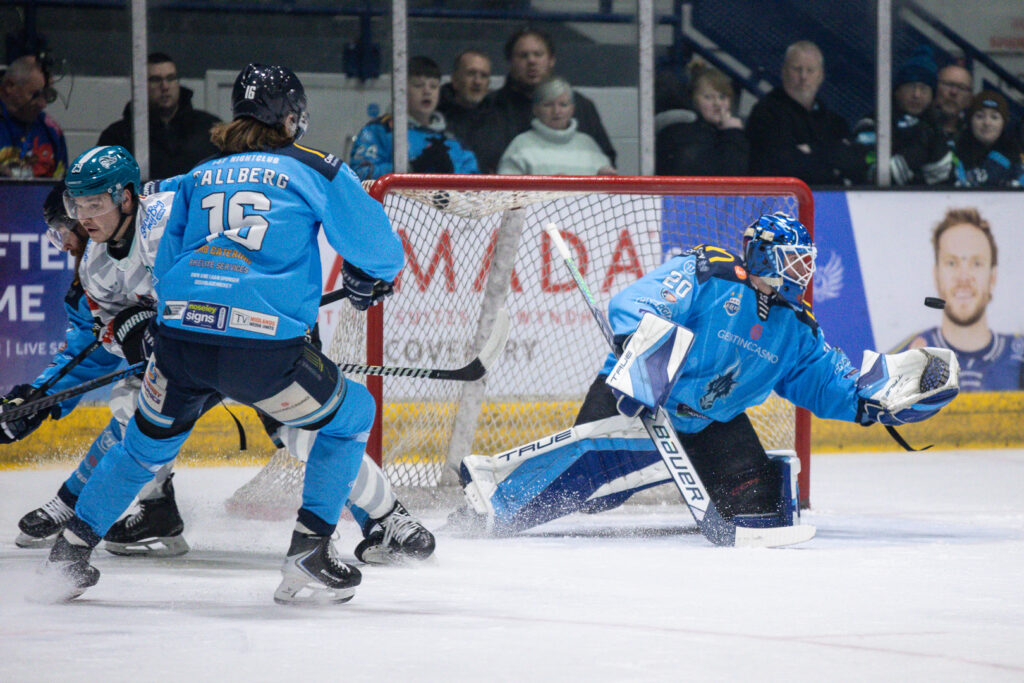 Robson makes a glove save. 