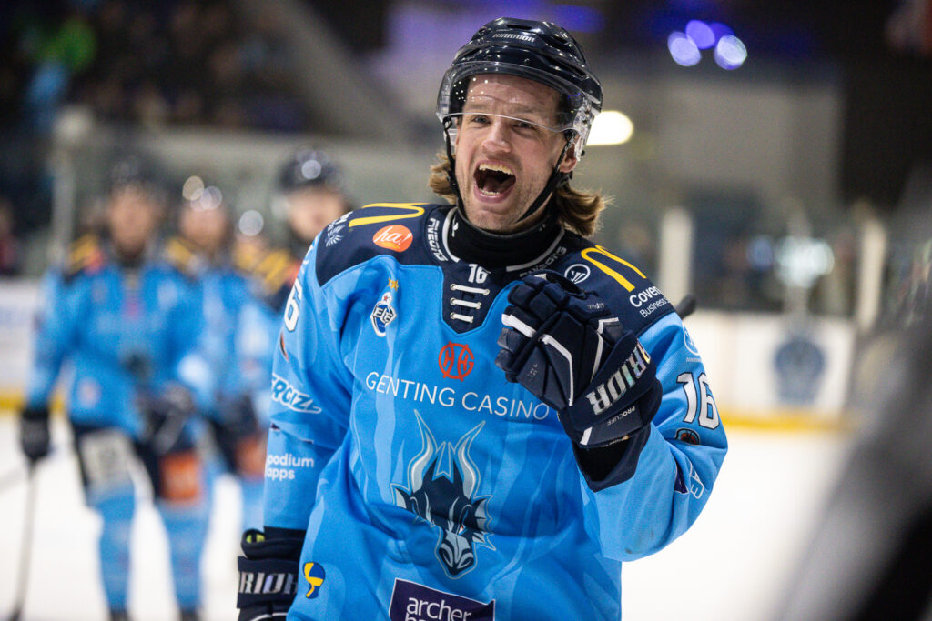 Tallberg celebrates scoring with fist bumps to the Blaze bench.