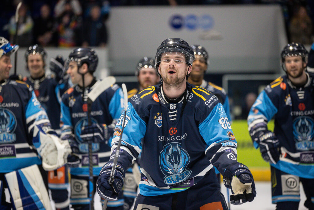 Mismash celebrates with the fans post-game.