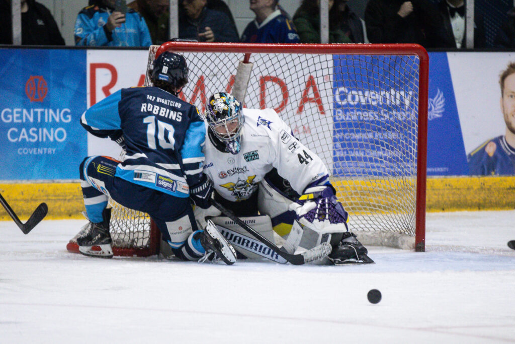 DeRidder makes a save on Robbins. 