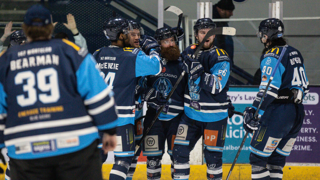 Saucerman celebrates with teammates after scoring the overtime winning goal. 