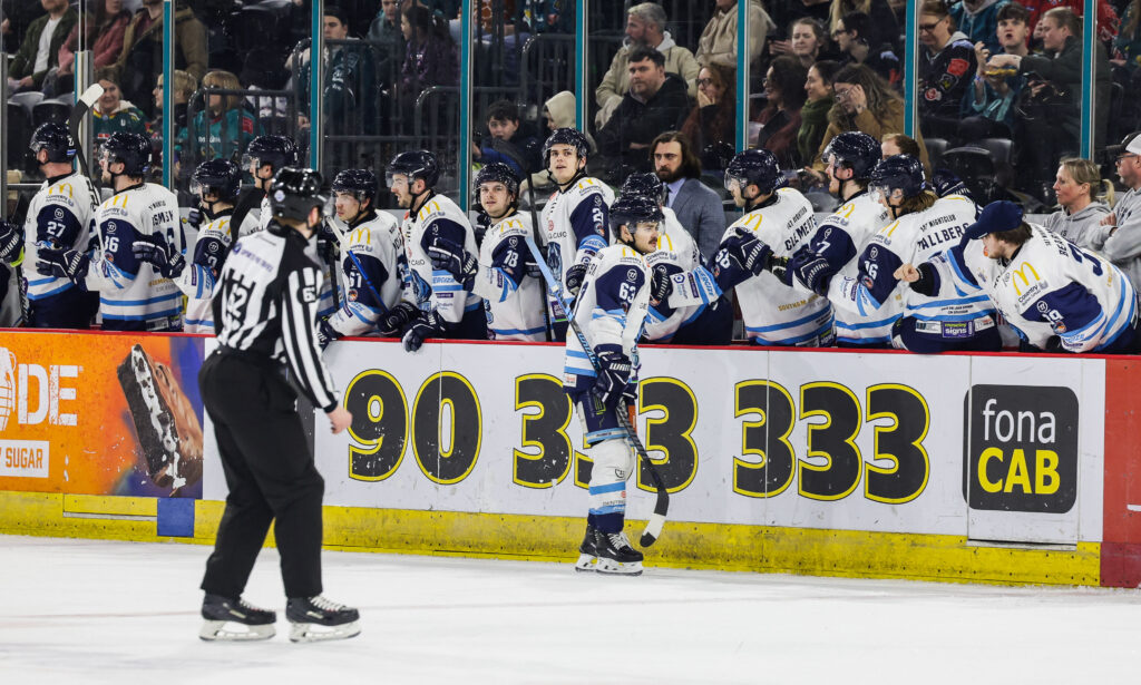 Gleason fist bumps the Blaze bench after scoring.