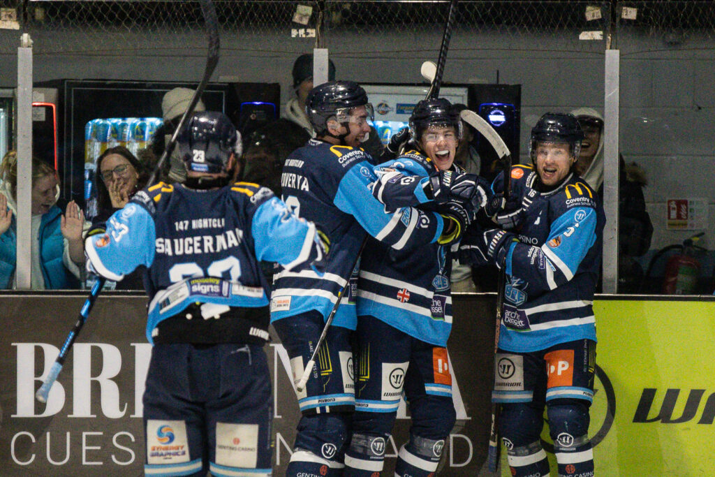 Capps celebrates scoring with teammates