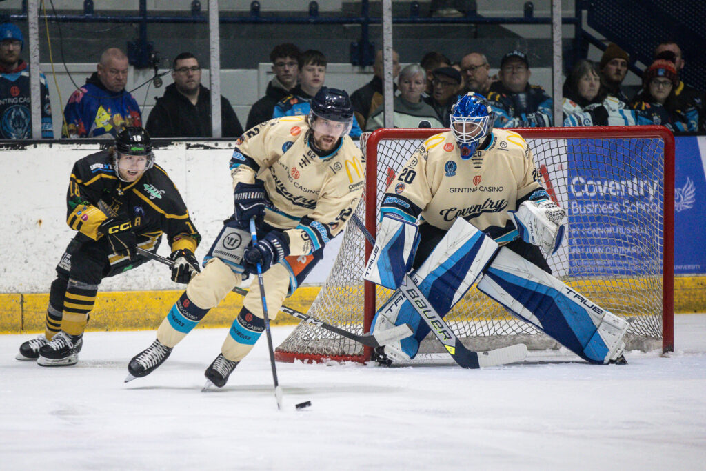 Vertanen skates with the puck wearing a Retro jersey.